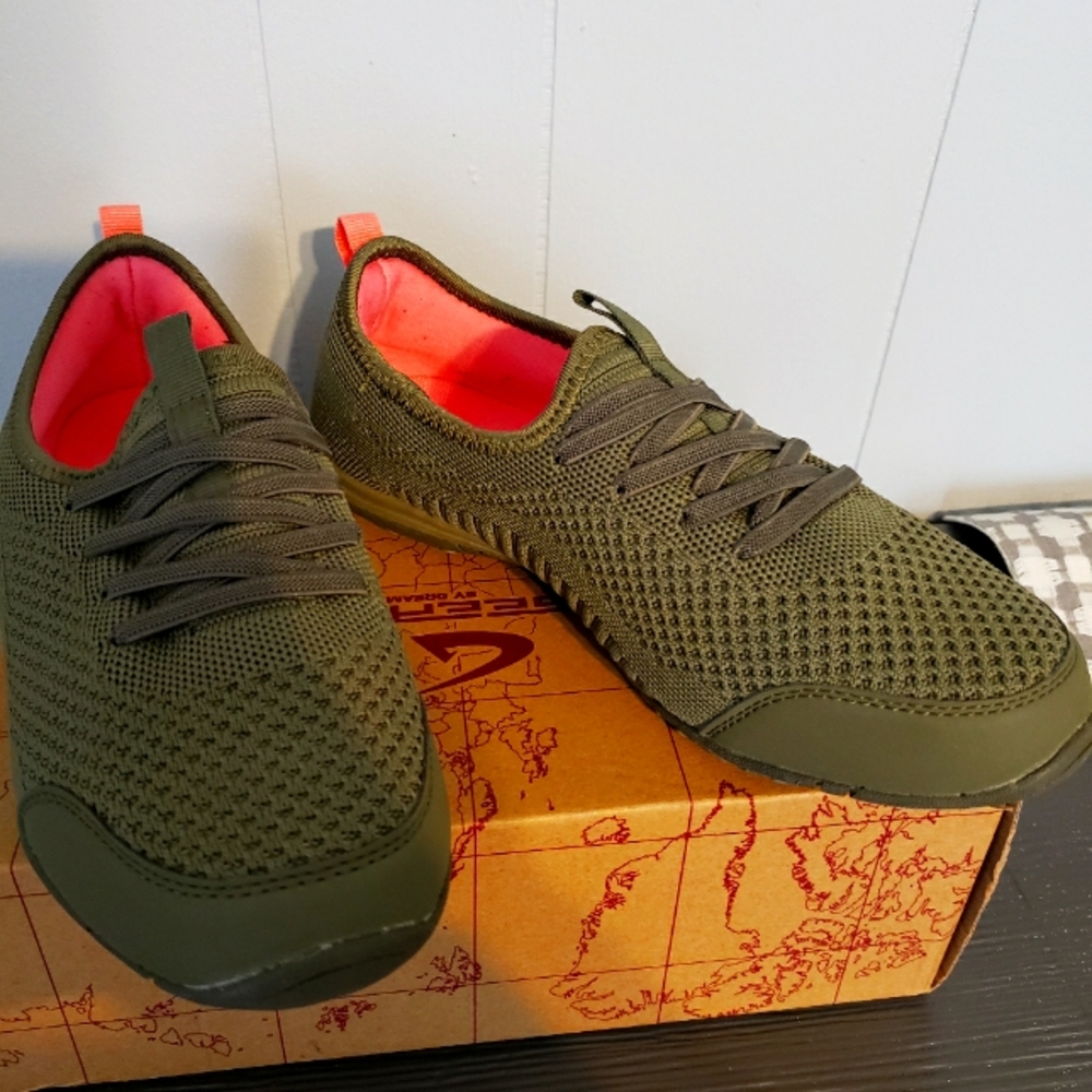 Brand new never worn. Slip on tennis shoes.